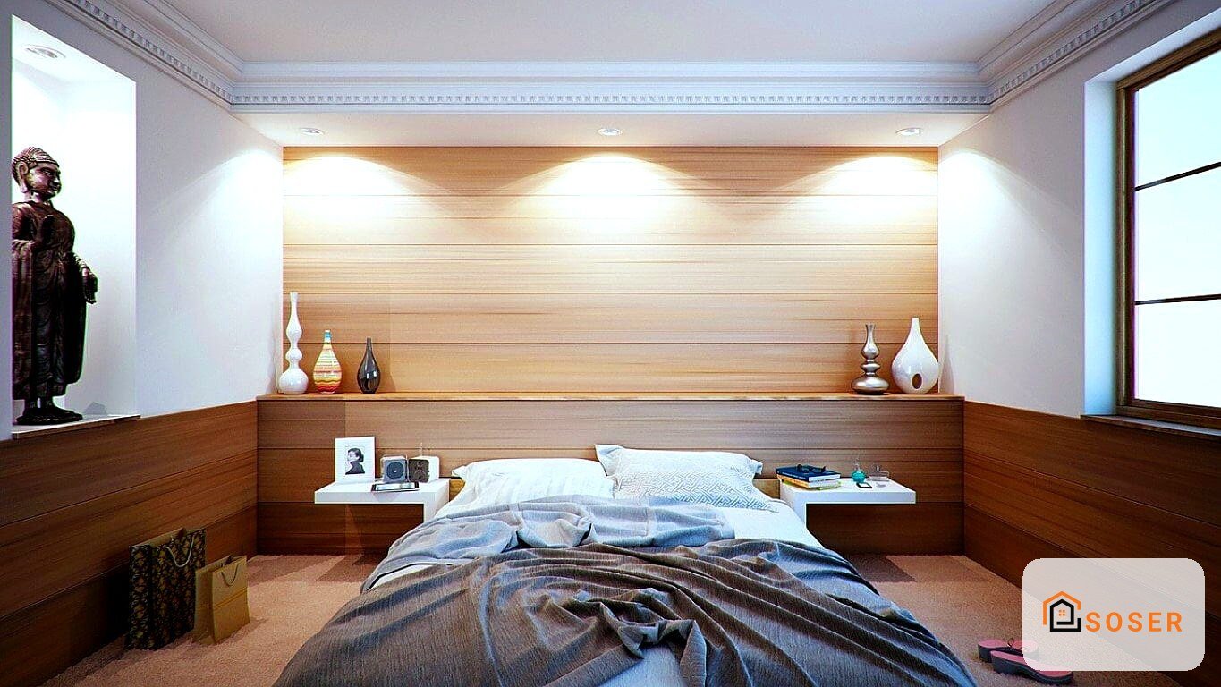 Camera da letto moderna con rivestimento in legno, letto con testata integrata e illuminazione a led